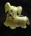 PRETTY GOLD TONE/PURPLE RHINESTONE BROOCH-