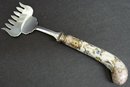 PRETTY PORCELAIN HANDLE BACON SERVING FORK