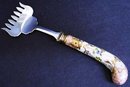 PRETTY PORCELAIN HANDLE BACON SERVING FORK