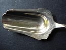 SMALL VICTORIAN STERLING CHEESE SCOOP