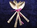 FOUR TINY SILVER COFFEE SPOONS-CORONATION