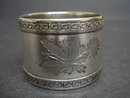 ANTIQUE NAPKING RING - FLORAL ENGRAVINGS
