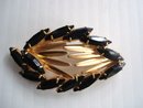 Oval Rhinestone Brooch Black and Gold