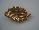 Oval Rhinestone Brooch Black and Gold