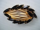 Oval Rhinestone Brooch Black and Gold