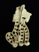Early Plastic Brooch Dog