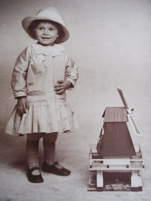 Real Photo Postcard Tiny Girl w/ Windmill Toy