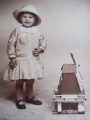 Real Photo Postcard Tiny Girl w/ Windmill Toy