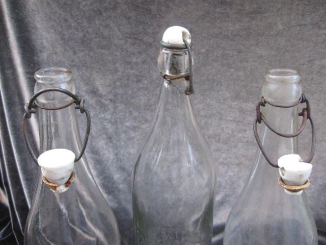 3 Vintage Glass Bottles With Ceramic Stoppers