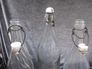 3 Vintage Glass Bottles With Ceramic Stoppers