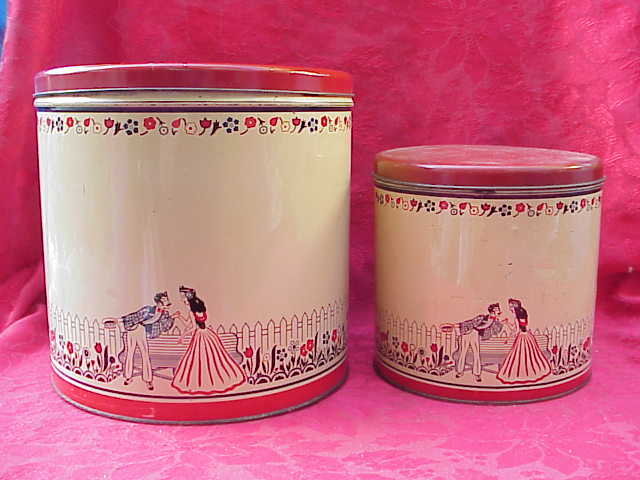 2 Mid Century Man & Woman Courting Large Tin Canisters