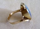 Ladys Firey Opal Doublet Ring- Marked 9ct.- Weighs 5.6 Grams