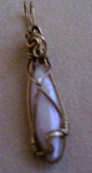 A Ladys Pearl Pendant wrapped in 14K Gold