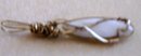 A Ladys Pearl Pendant wrapped in 14K Gold