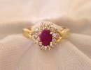 Ladys Ring: .75 cts.Ruby and .33cts. Diamonds:,4.40 grms.Yellow gold