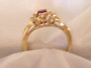 Ladys Ring: .75 cts.Ruby and .33cts. Diamonds:,4.40 grms.Yellow gold