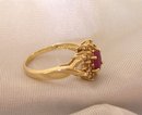 Ladys Ring: .75 cts.Ruby and .33cts. Diamonds:,4.40 grms.Yellow gold