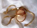 Ladys Yellow gold 16'' herringbone chain 12.0 grms. with yellow gold bezel set tortoise shell