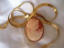 Ladys Yellow gold 16'' herringbone chain 12.0 grms. with yellow gold bezel set tortoise shell