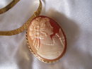Ladys Yellow gold 16'' herringbone chain 12.0 grms. with yellow gold bezel set tortoise shell