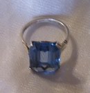 A Ladys Large Dark Blue Topaz Ring in 14K White Gold-5.0 grams.