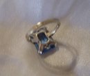 A Ladys Large Dark Blue Topaz Ring in 14K White Gold-5.0 grams.