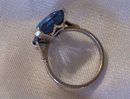 A Ladys Large Dark Blue Topaz Ring in 14K White Gold-5.0 grams.