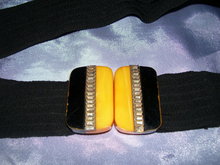 A Vintage Bakelite black and yellow Belt buckle on Black cloth ladys belt