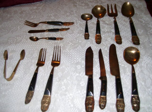 A vintage complete 59 piece set Ebony carved wood- Hand hammered, ebony handle silverware