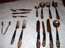 A vintage complete 59 piece set Ebony carved wood- Hand hammered, ebony handle silverware