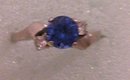 A ladys 1 carat London Blue Topaz Ring with two white topaz