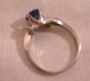 A ladys 1 carat London Blue Topaz Ring with two white topaz