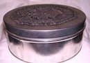 A Metzke large 8.00 by 3.00 inch copywright 1880 Santa ClausCandy Cannister