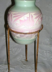 A Horizonal pottery vase, Hand painted by Native American Artist