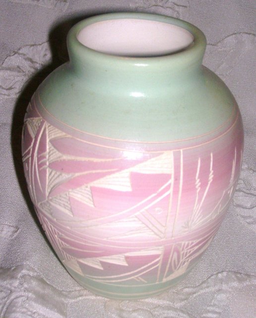 A Horizonal pottery vase, Hand painted by Native American Artist