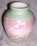 A Horizonal pottery vase, Hand painted by Native American Artist