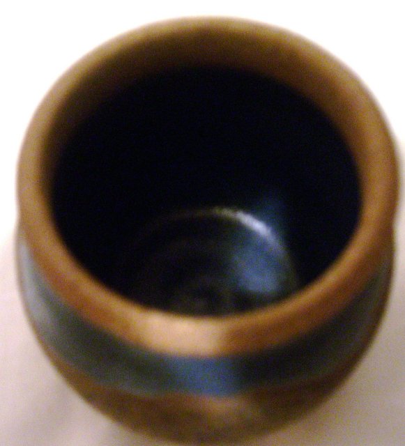 A Green and Tan Handcrafted stoneware pot=signed Parker 84