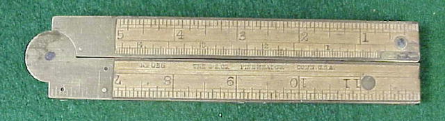 folding brass and wood ruler with level and