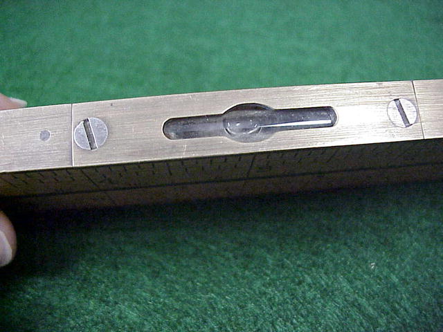 folding brass and wood ruler with level and