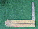 folding brass and wood ruler with level and