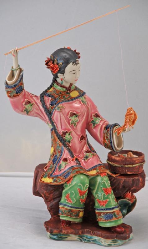 Lady Fishing with Bucket of Fish
