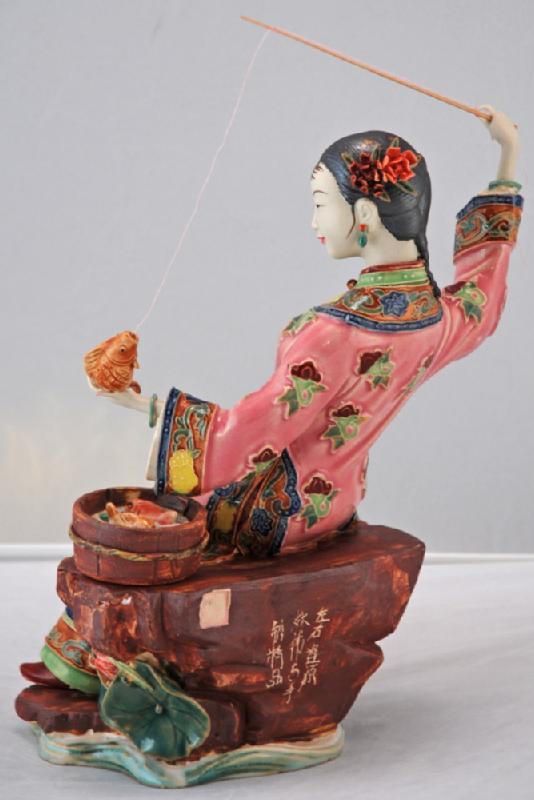 Lady Fishing with Bucket of Fish