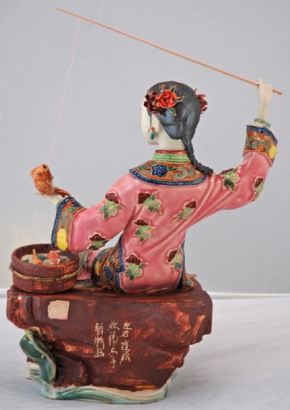 Lady Fishing with Bucket of Fish