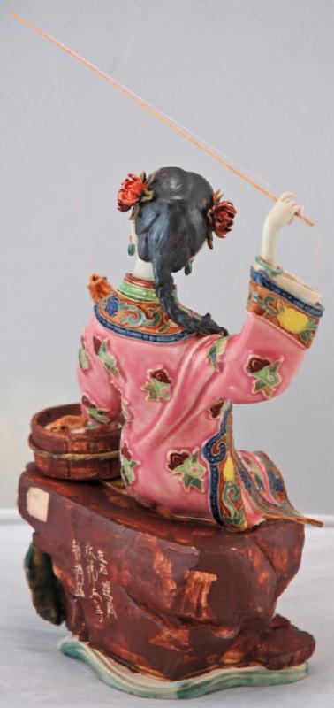 Lady Fishing with Bucket of Fish