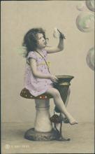 Vintage postcard, tinted photo of a little girl with bubbles