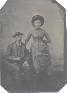 TINTYPE OF VICTORIAN COUPLE WITH GREAT HATS