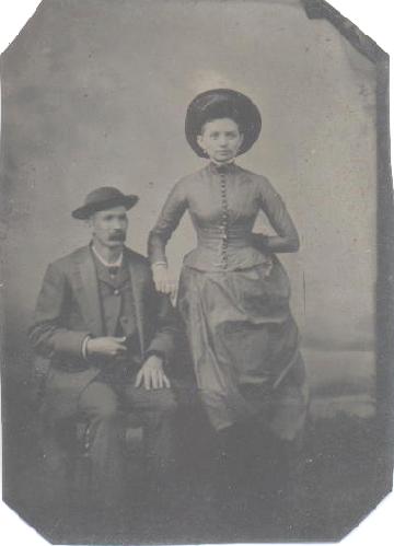 TINTYPE OF VICTORIAN COUPLE WITH GREAT HATS