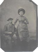 TINTYPE OF VICTORIAN COUPLE WITH GREAT HATS