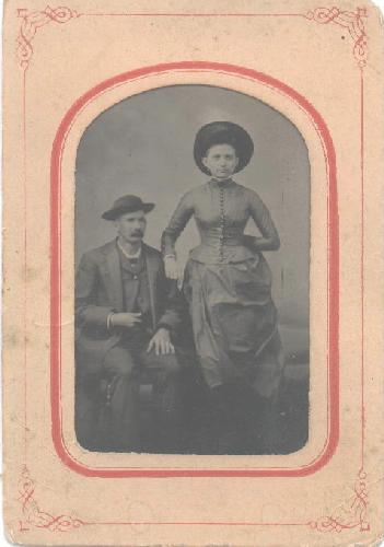 TINTYPE OF VICTORIAN COUPLE WITH GREAT HATS