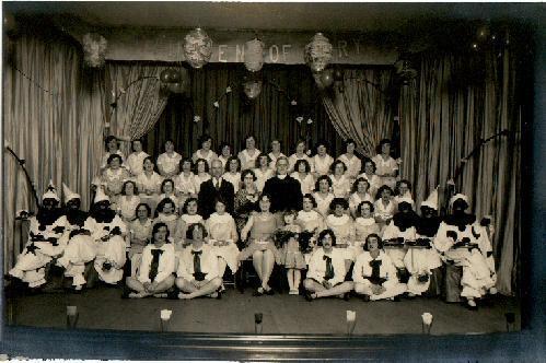 PHOTOGRAPH OF STAGE SHOW WITH BLACK FACE PERFORMERS